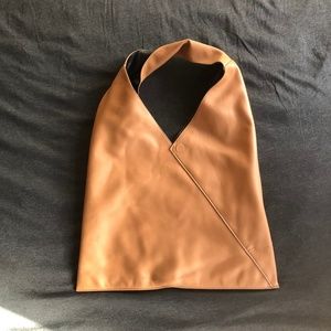 Chic reversible black/beige vegan leather tote